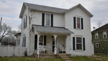 a white two story house that could be sold as is in florida