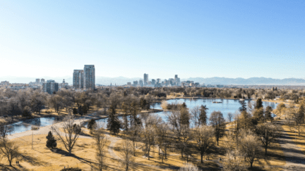 aerial view of a lake in the city where houses are bought by We Buy Houses companies.