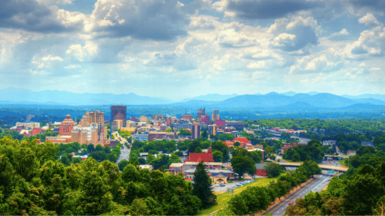 An aerial image of Asheville, which can represent selling a house fast in Asheville