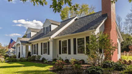 A house with a room addition.