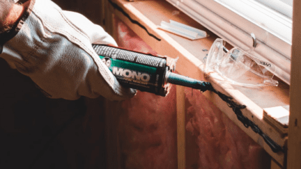 Display picture of a window frame being glued in a home