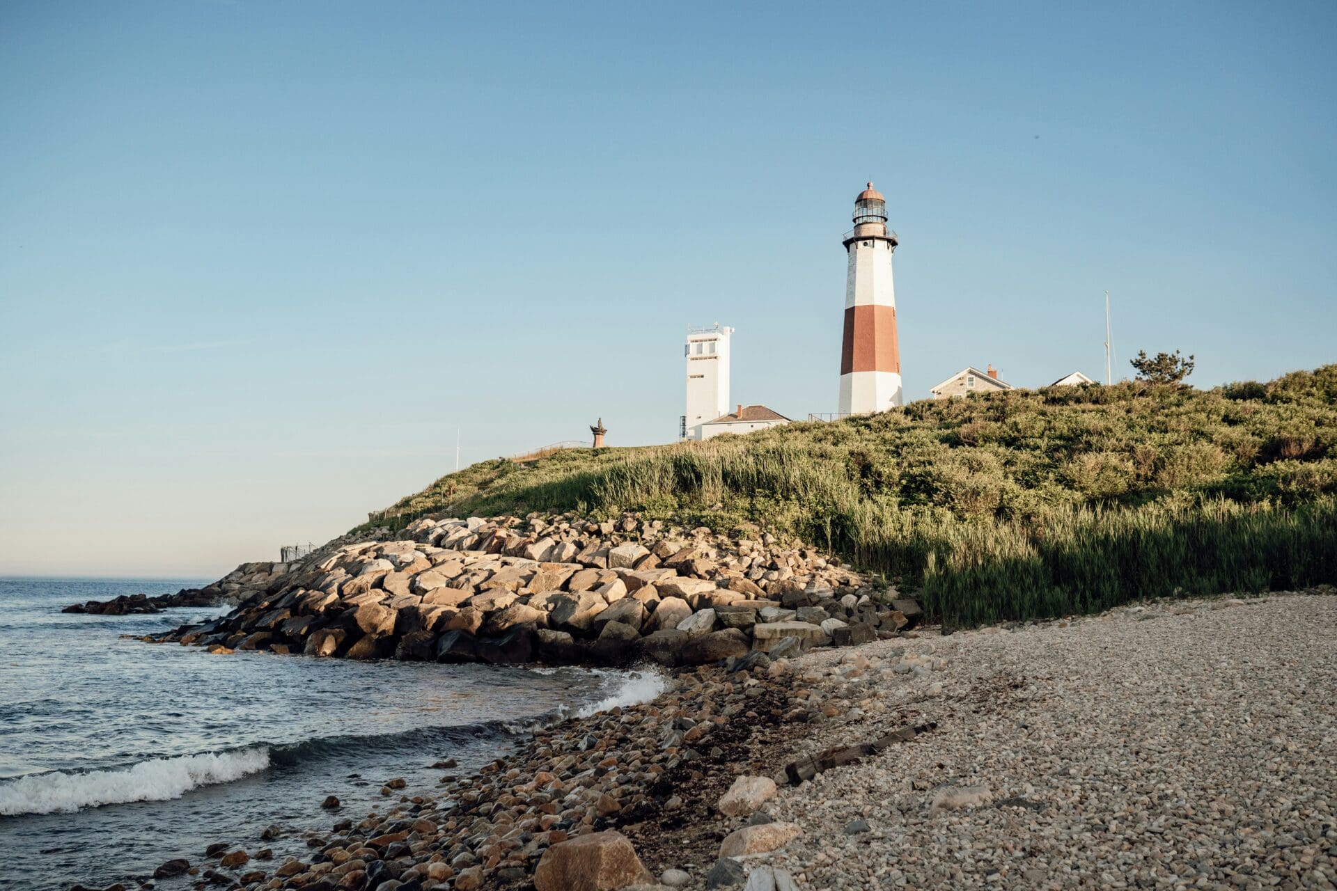 A landscape shot of the Montauk Lighthouse in Long Island, New York on a sunny day.