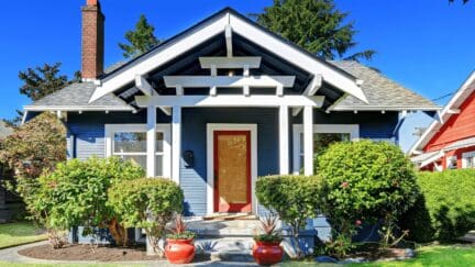 A blue house sold to a house buying company
